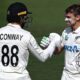 Dean Conway (left) congratulates Tom Latham on his century