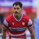 Tomos Williams standing on the pitch during a match for Gloucester