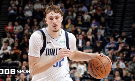 Cooper Flagg dribbles the ball