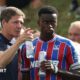 Marc Guehi and Oliver Glasner manager sat side by side during a media conference ahead of the Conference League match between Dynamo Kyiv and Crystal Palace in October.