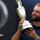 Luke Littler celebrates winning the 2026 PDC World Championship as tickertape falls