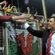 Chris Coleman celebrates with Wales fans after qualifying for Euro 2016 following the 2-0 loss in Bosnia-Herzegovina in 2015