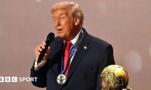 U.S. President Donald Trump speaks as he receives the FIFA Peace Prize from Gianni Infantino