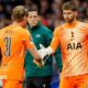 Guglielmo Vicario embracing Antonin Kinsky as he replaces him as Tottenham goalkeeper during their first-leg defeat to Atletico Madrid