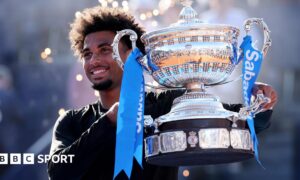Arthur Fils holds the trophy after winning in Barcelona