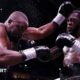 Derek Chisora is punched by Deontay Wilder