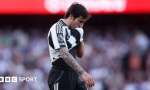 Newcastle's Sandro Tonali wipes his face with his shirt