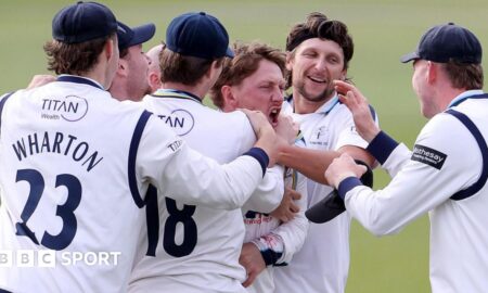 Dom Bess of Yorkshire celebrates the catch that dismissed Kiran Carlson