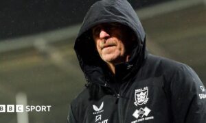 Hull FC head coach John Cartwright in a club issued coat