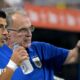 Marcelo Bielsa pointing while standing on the sidelines with Luis Suarez