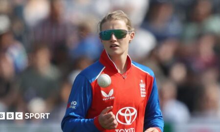 England spinner Charlie Dean tosses up the ball