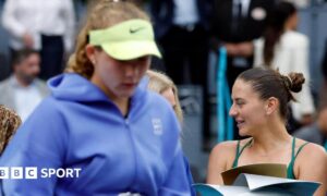 Ukraine's Marta Kostyuk (right) and Russia's Mirra Andreeva in the Madrid Open trophy ceremony