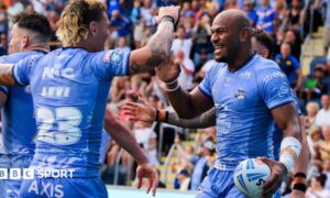Leeds' Maika Sivo (right) celebrates scoring a try against Hull KR.