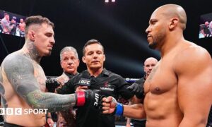 Tom Aspinall and Ciryl Gane touch gloves before their UFC fight in October 2025