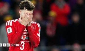 Wales' Neco Williams covers his face with his hands after missing his penalty in the shoot-out during the 2026 FIFA World Cup European Play-off Semi-final.