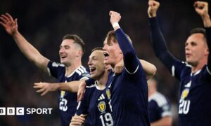 Scott McTominay leads Scotland's celebrations after qualifying for the World Cup