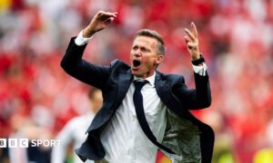 Jesse Marsch celebrates after Canada beat Qatar
