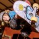 Jaxon Popovic holds a skateboard in mid-air