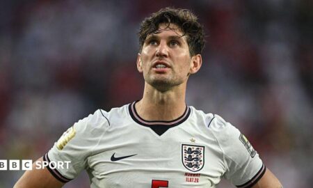 John Stones wearing an England shirt