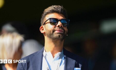 Amit Bhatia looks on from the Loftus Road directors' box during a Championship match