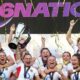 Meg Jones lifts the Women's Six Nations trophy surrounded by team-mates with tickertape falling down