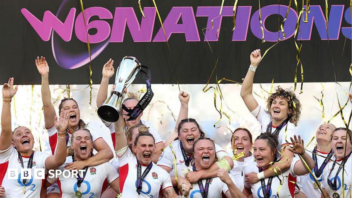 Meg Jones lifts the Women's Six Nations trophy surrounded by team-mates with tickertape falling down