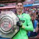 Crystal Palace keeper Dean Henderson holds up the Community Shield after his side's penalty shootout win over Liverpool