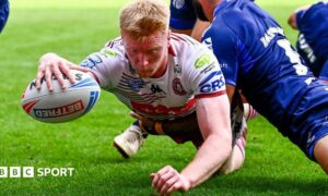 Zach Eckersley extends his right arm to touch the ball down and score Wigan's opening try against Toulouse