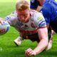 Zach Eckersley extends his right arm to touch the ball down and score Wigan's opening try against Toulouse