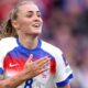 Georgia Stanway pats her chest in celebration