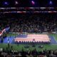 A giant flag is unfurled on the Arthur Ashe Stadium on the 25th anniversary of the 9/11 attacks