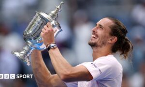 Alexander Zverev celebrates with the US Open trophy