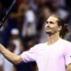 Alexander Zverev raises his racquet to the crowd